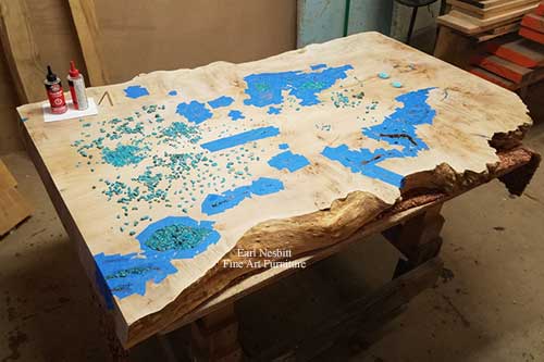 glue up of turquoise inlay on cluster burl maple coffee table